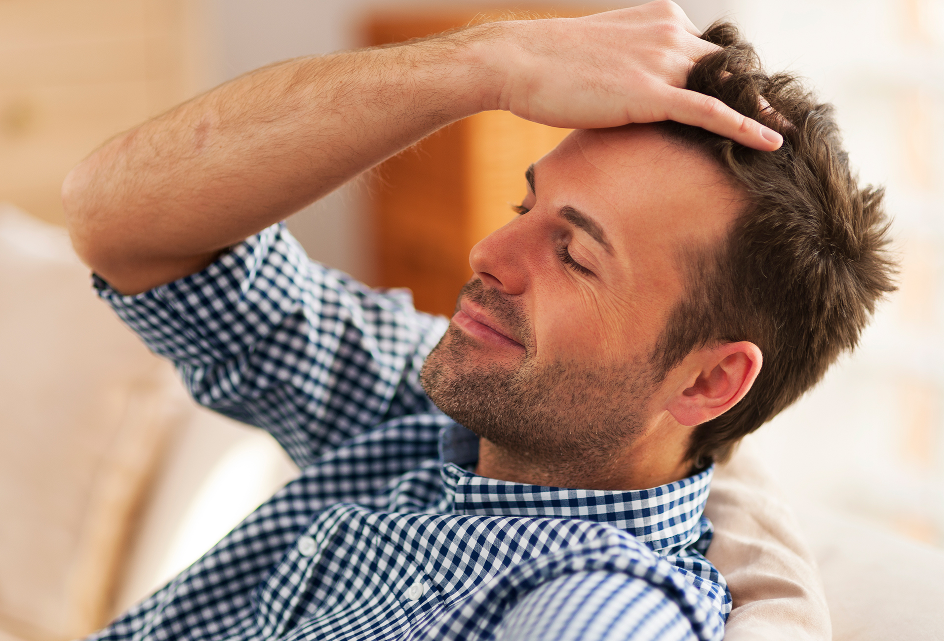 man running his hands through his hair