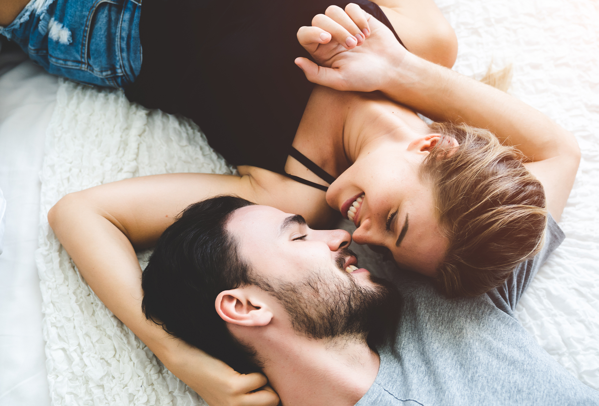 couple smiling while looking at eachother