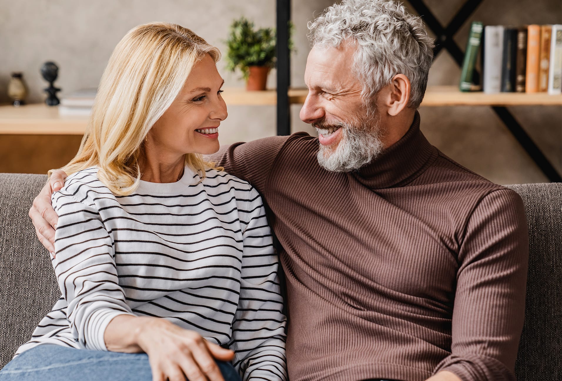 couple smiling on a couch