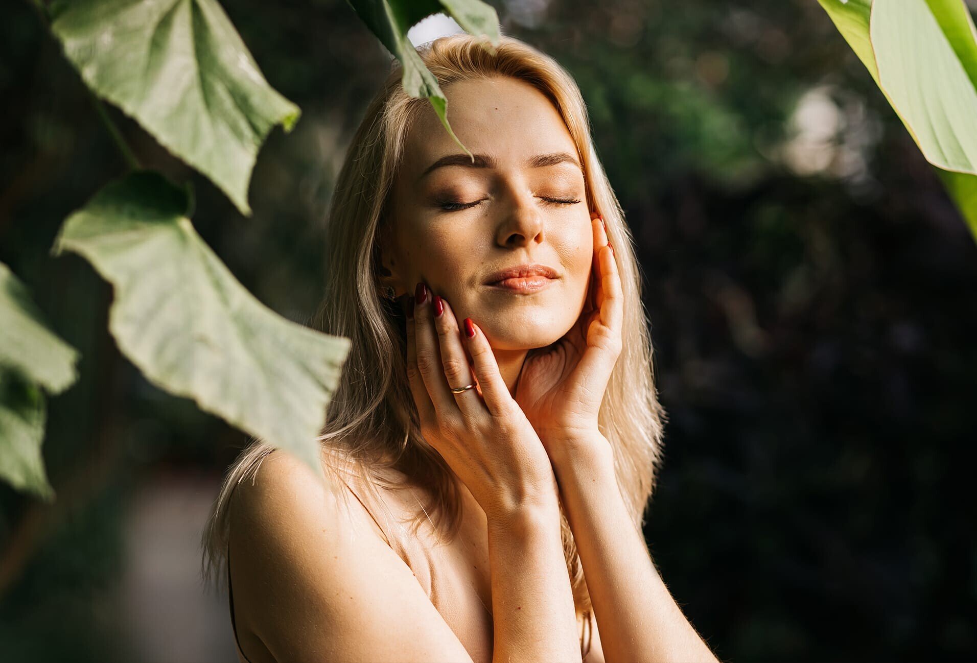 woman touching her face