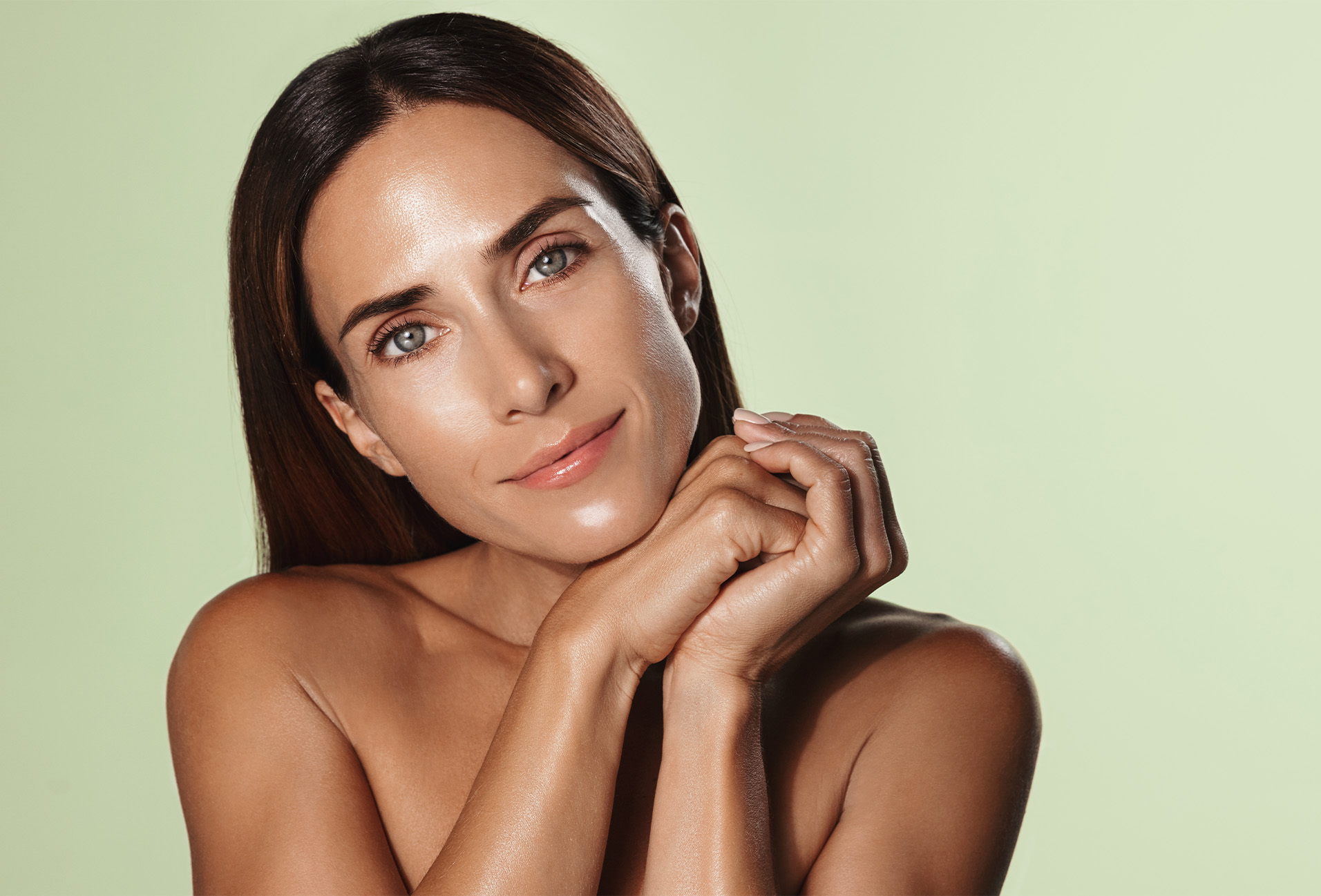 woman resting her face on her hands