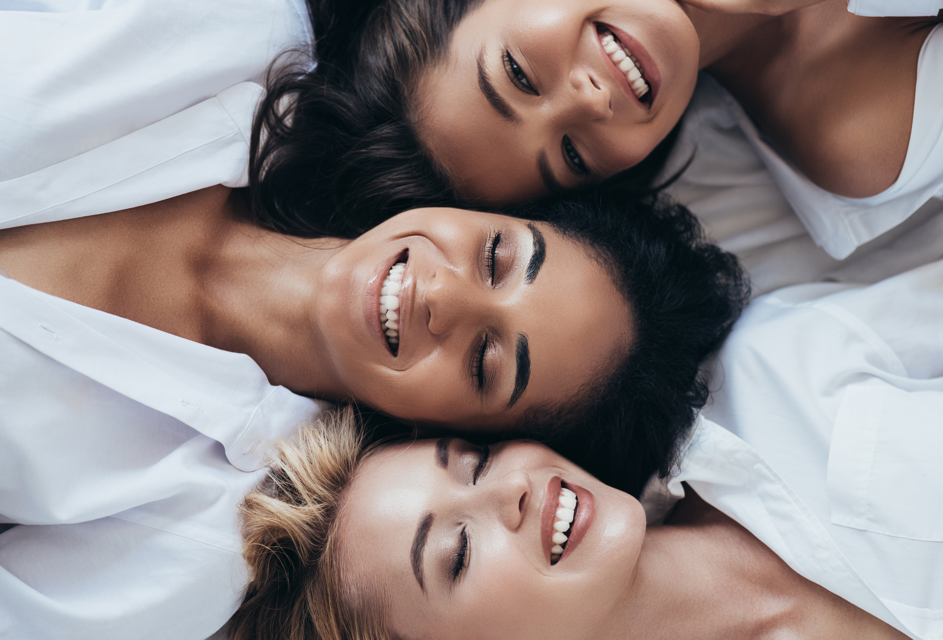 three woman smiling