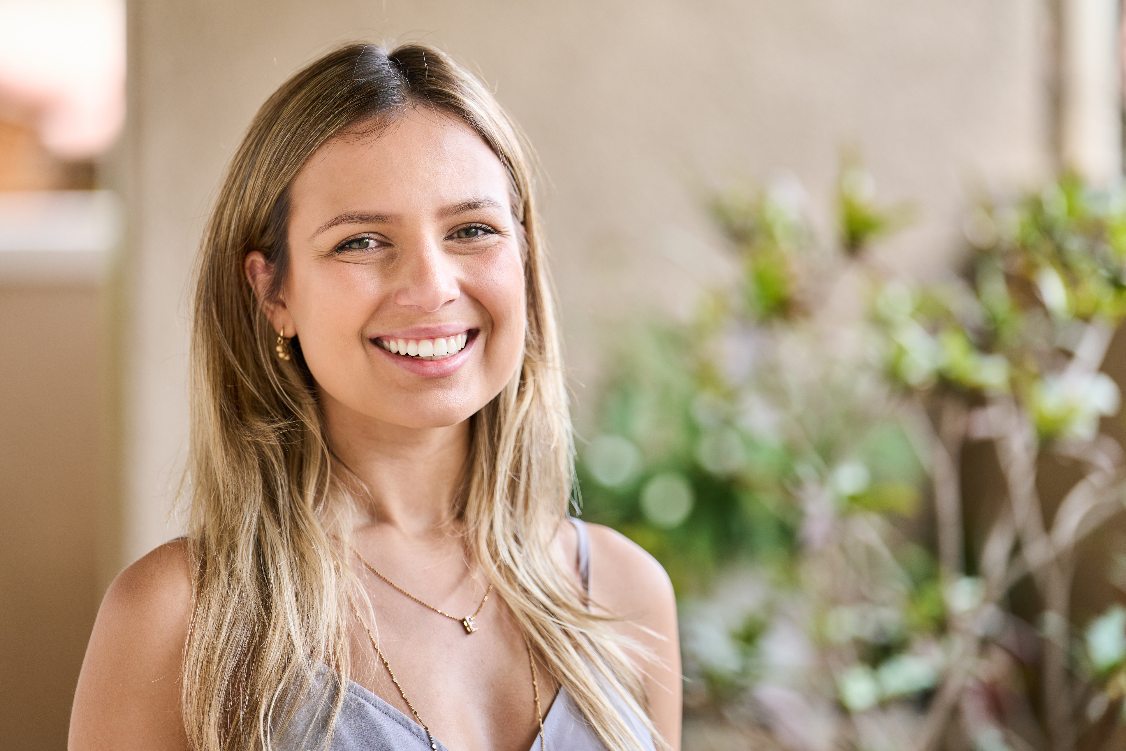 Woman with long blonde hair smiling